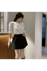 Schwarz-weißer Puffrock in A-Linie