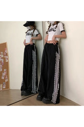 Gestreifte Hose mit weitem Bein und Spitzenbesatz