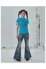 Top mit Strasssteinen in tropischen Wellen