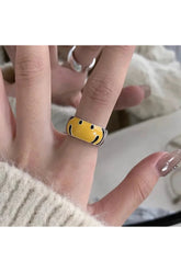 Bague en argent avec visage souriant jaune